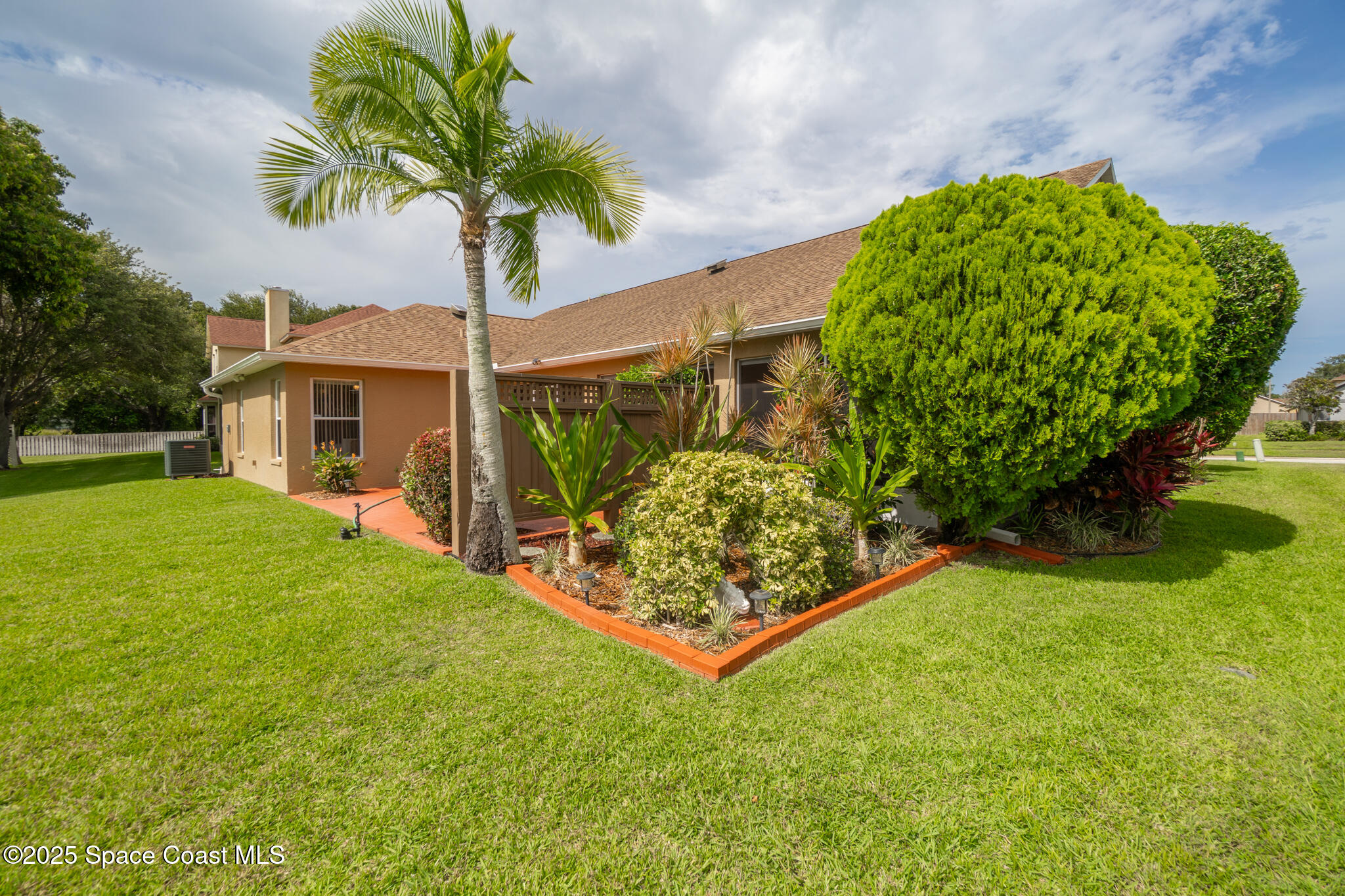 4808 Springwater Circle Melbourne, FL 32940 - Photo 30 of 38 a front view of a house with garden