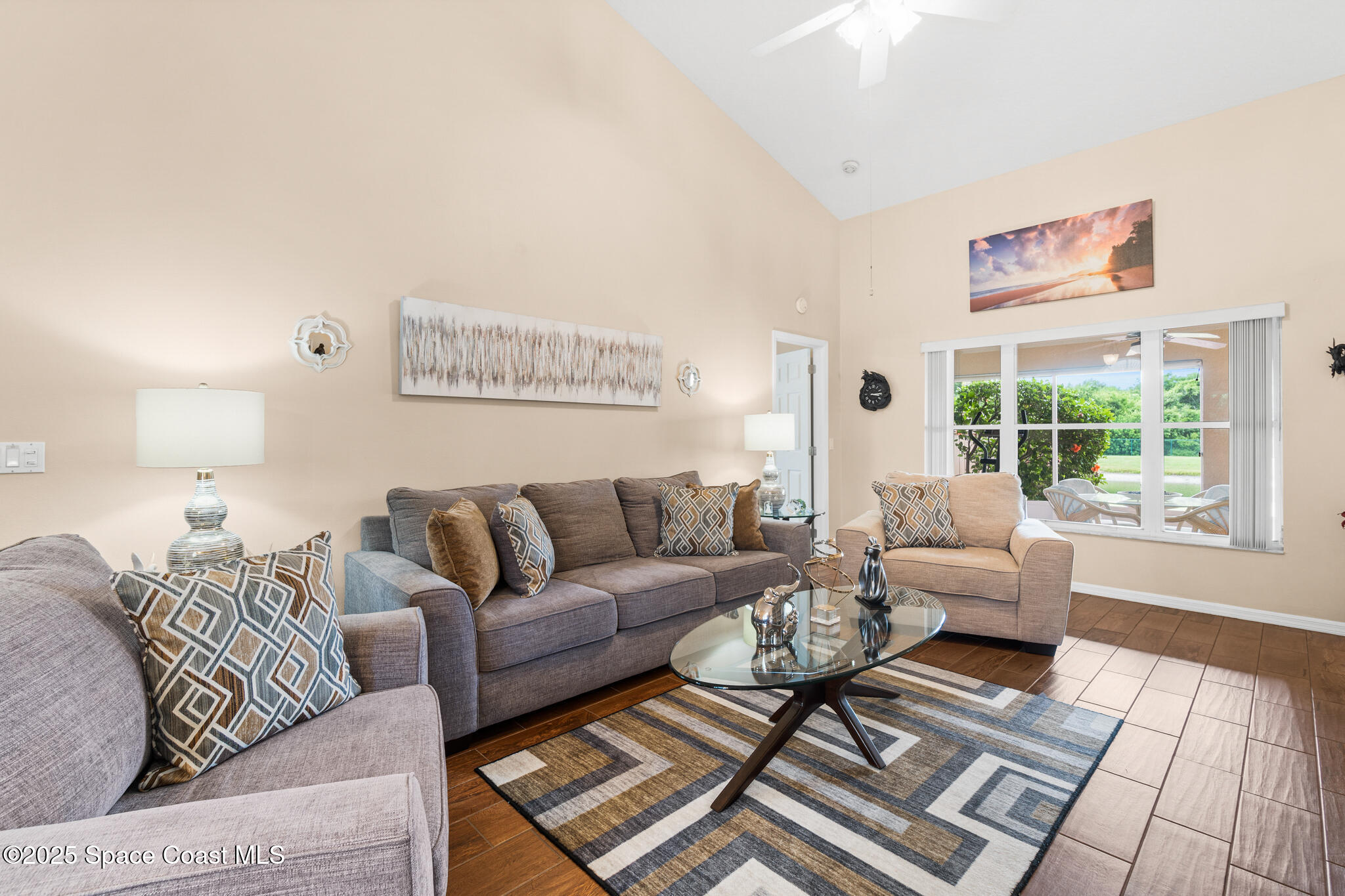 4808 Springwater Circle Melbourne, FL 32940 - Photo 7 of 38 a living room with furniture and a rug