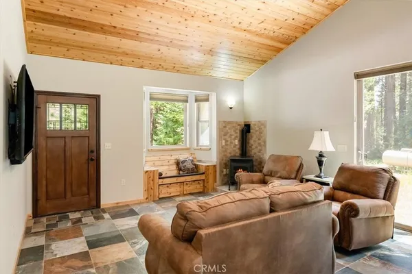 a bedroom with furniture and a window