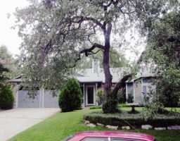 11912 Snow Goose Road Austin, TX 78758 - Photo 1 of 1 a front view of a house with a garden and trees