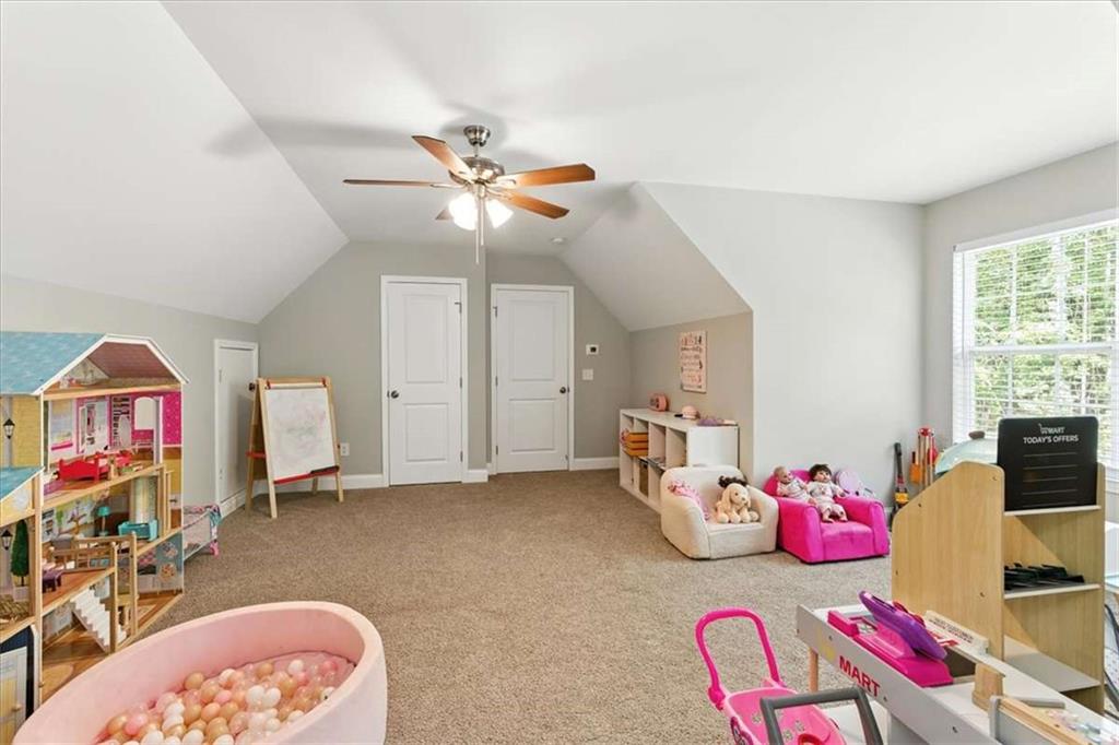 62 Joe Rowell Road Buchanan, GA 30113 - Photo 39 of 63 a bedroom with furniture and a chandelier