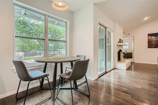 a view of a livingroom with furniture and a window