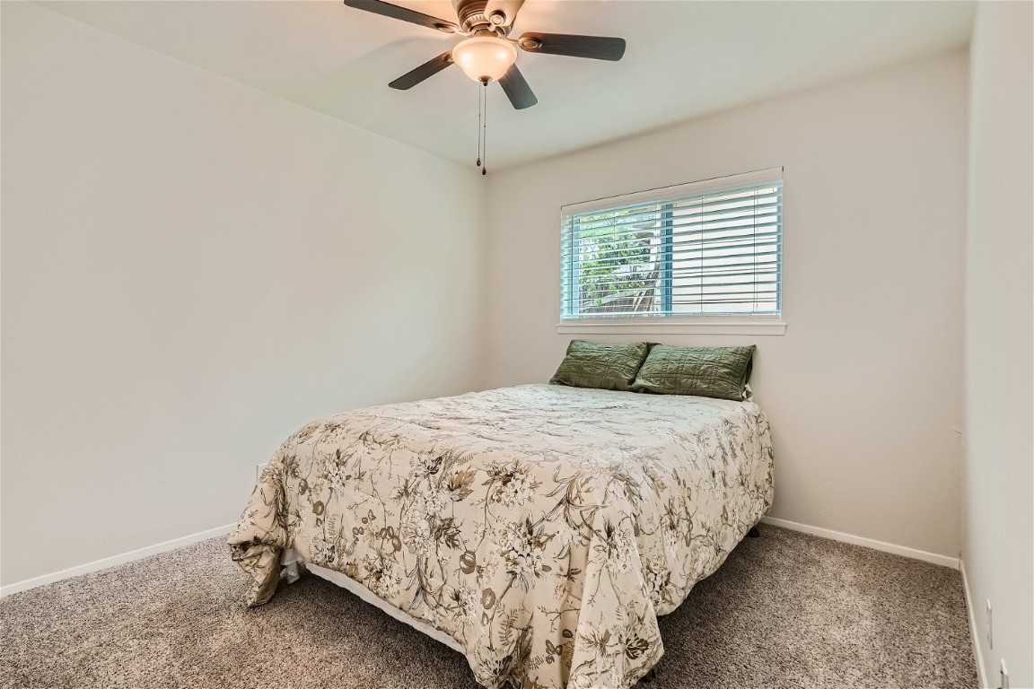 6614 Ashland Drive Austin, TX 78723 - Photo 19 of 28 a bedroom with a bed and window