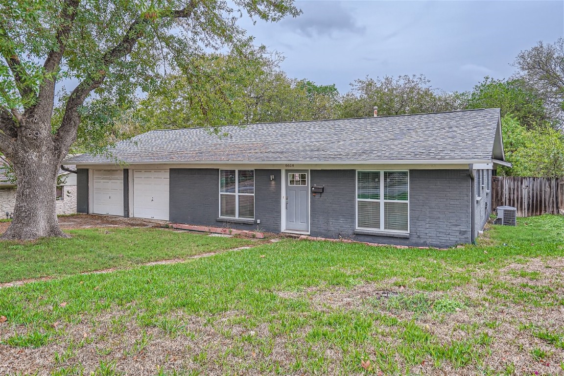 6614 Ashland Drive Austin, TX 78723 - Photo 2 of 28 a front view of a house with a garden