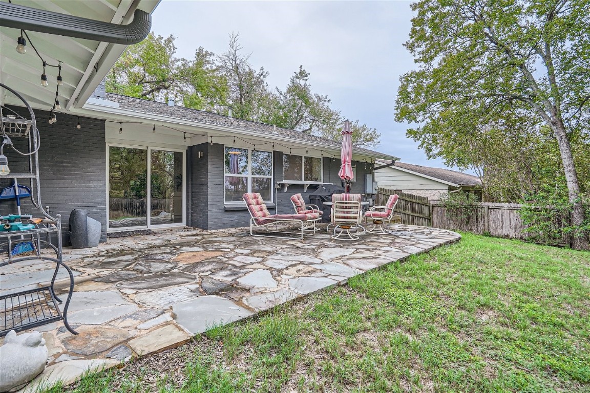 6614 Ashland Drive Austin, TX 78723 - Photo 25 of 28 a view of a patio with table and chairs near a barn