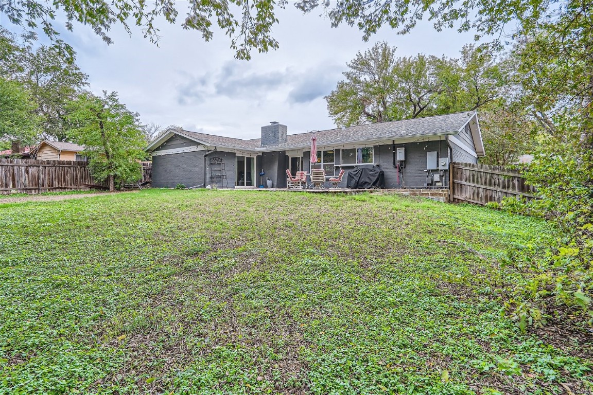 6614 Ashland Drive Austin, TX 78723 - Photo 27 of 28 a view of a house with a big yard and large trees