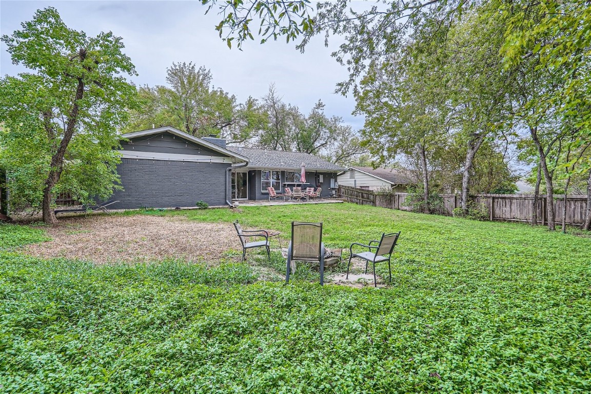 6614 Ashland Drive Austin, TX 78723 - Photo 28 of 28 a view of a chair and table in backyard of the house