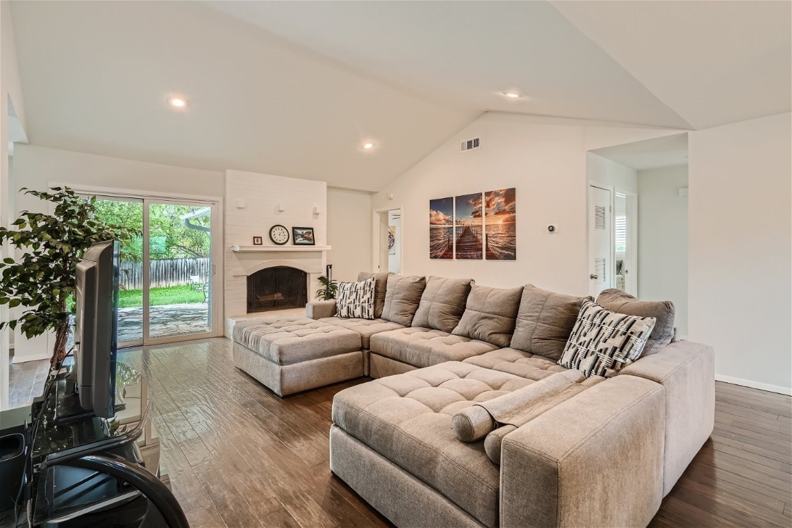 6614 Ashland Drive Austin, TX 78723 - Photo 4 of 28 a living room with furniture gym equipment and a large window