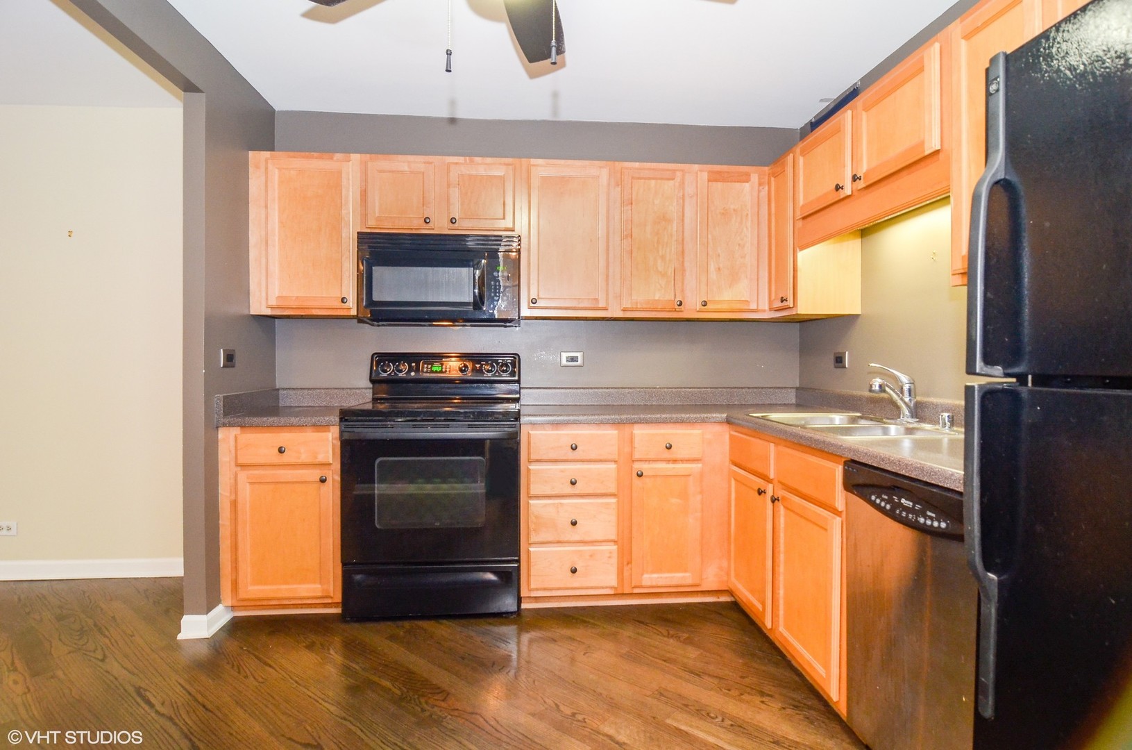 211 East Ohio Street, Unit 809 Chicago, IL 60611 - Photo 7 of 17 a kitchen with stainless steel appliances granite countertop a stove a sink and a refrigerator
