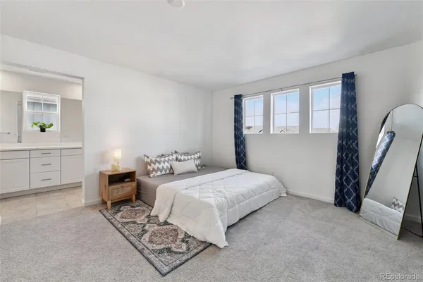 a bedroom with a bed and a cabinets