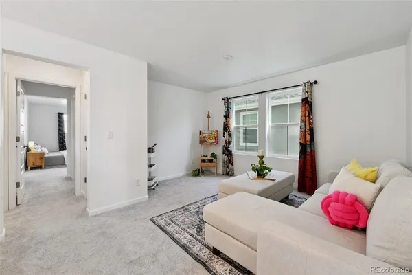 a bedroom with furniture and a windows