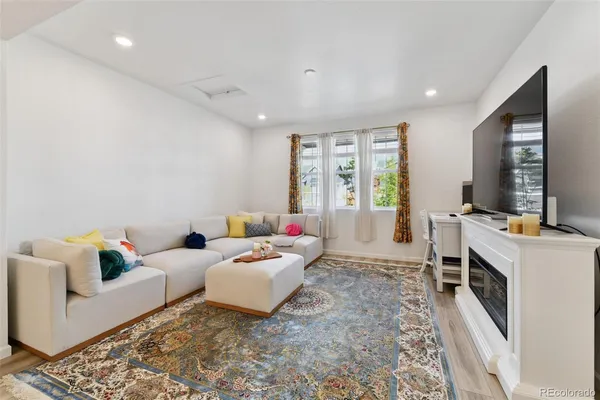 a living room with furniture and window