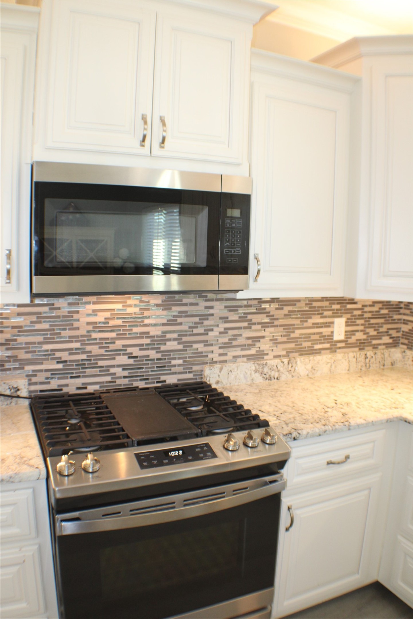 5305 Wheeler Road Lumberton, TX 77657 - Photo 27 of 48 a stove top oven sitting inside of a kitchen