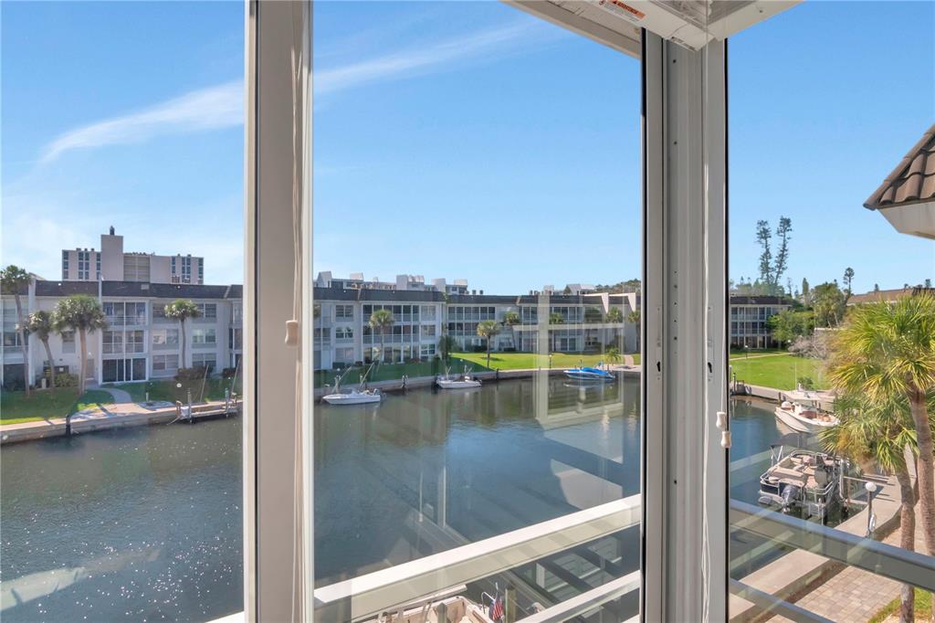 4390 Exeter Drive, Unit 305 Longboat Key, FL 34228 - Photo 26 of 78 a view of swimming pool from a window