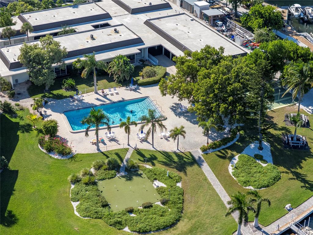 4390 Exeter Drive, Unit 305 Longboat Key, FL 34228 - Photo 31 of 78 an aerial view of a house with a yard basket ball court and outdoor seating