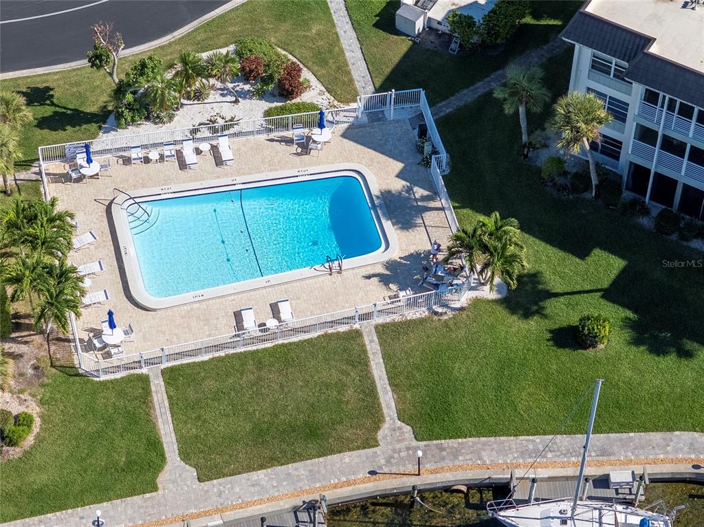 4390 Exeter Drive, Unit 305 Longboat Key, FL 34228 - Photo 32 of 78 an aerial view of a chairs and table