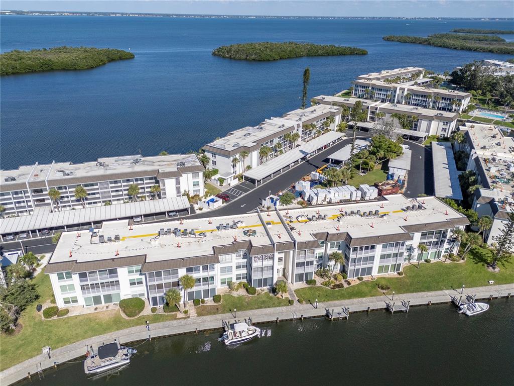 4390 Exeter Drive, Unit 305 Longboat Key, FL 34228 - Photo 47 of 78 a view of building with outdoor space