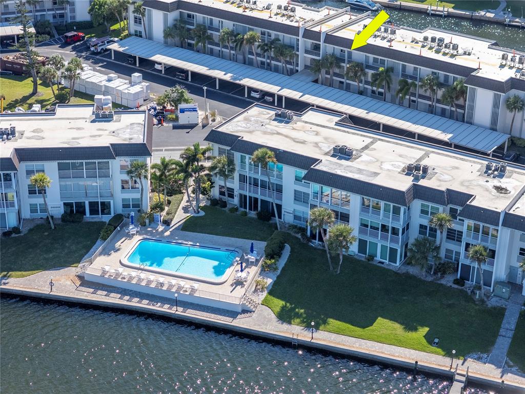 4390 Exeter Drive, Unit 305 Longboat Key, FL 34228 - Photo 50 of 78 an aerial view of a house with swimming pool