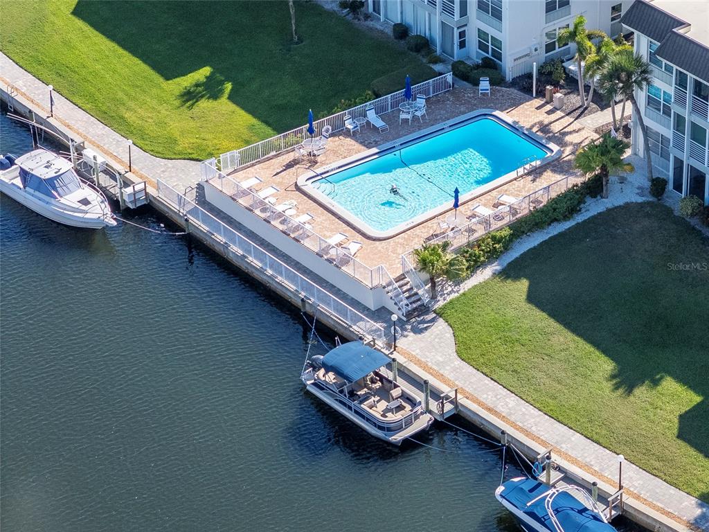 4390 Exeter Drive, Unit 305 Longboat Key, FL 34228 - Photo 54 of 78 an aerial view of a residential houses with outdoor space