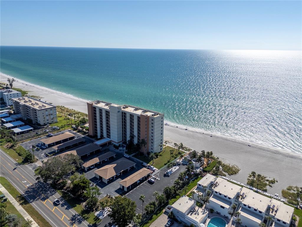 4390 Exeter Drive, Unit 305 Longboat Key, FL 34228 - Photo 58 of 78 an aerial view of a house with a yard