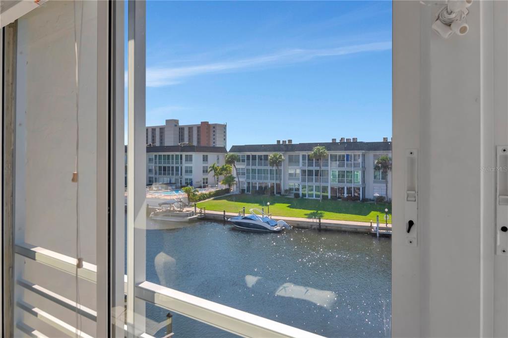 4390 Exeter Drive, Unit 305 Longboat Key, FL 34228 - Photo 6 of 78 a view of an empty room with a floor to ceiling window