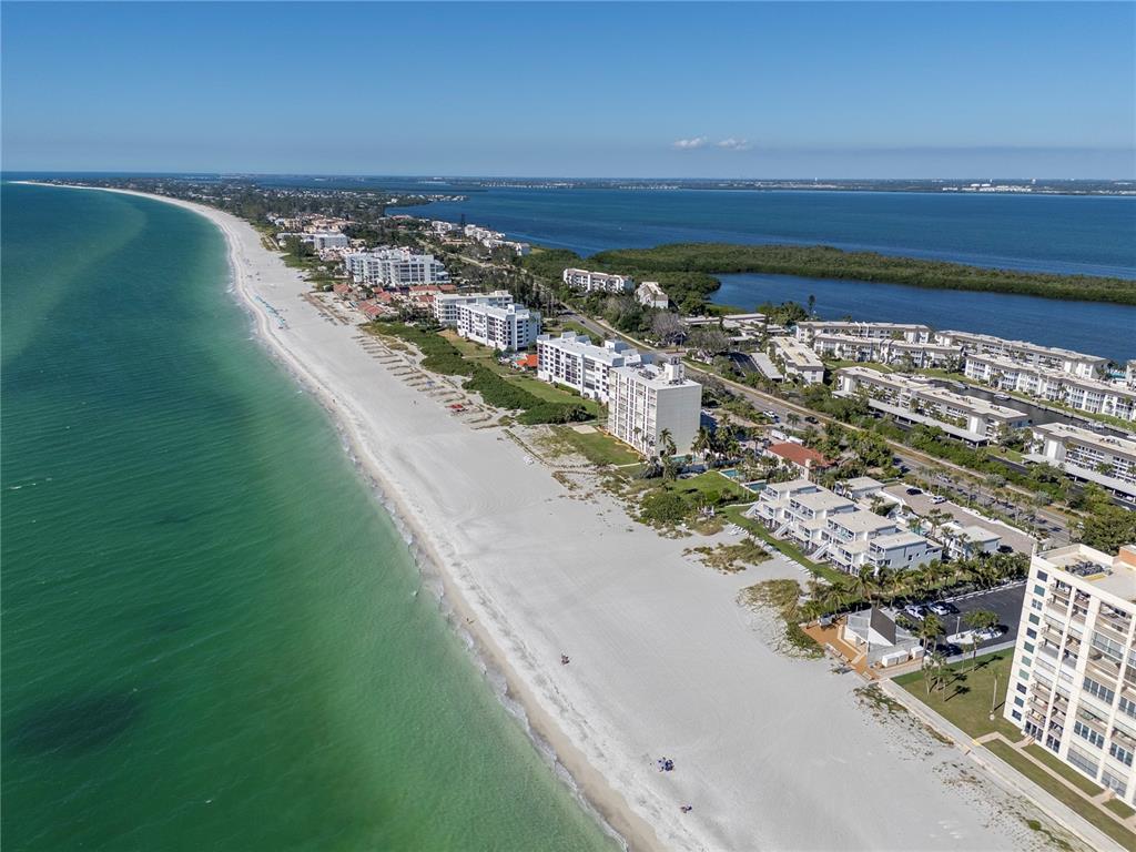 4390 Exeter Drive, Unit 305 Longboat Key, FL 34228 - Photo 64 of 78 a view of a city and ocean view
