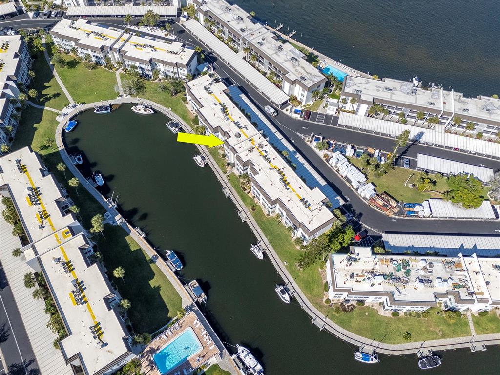 4390 Exeter Drive, Unit 305 Longboat Key, FL 34228 - Photo 67 of 78 aerial view of a house with a swimming pool