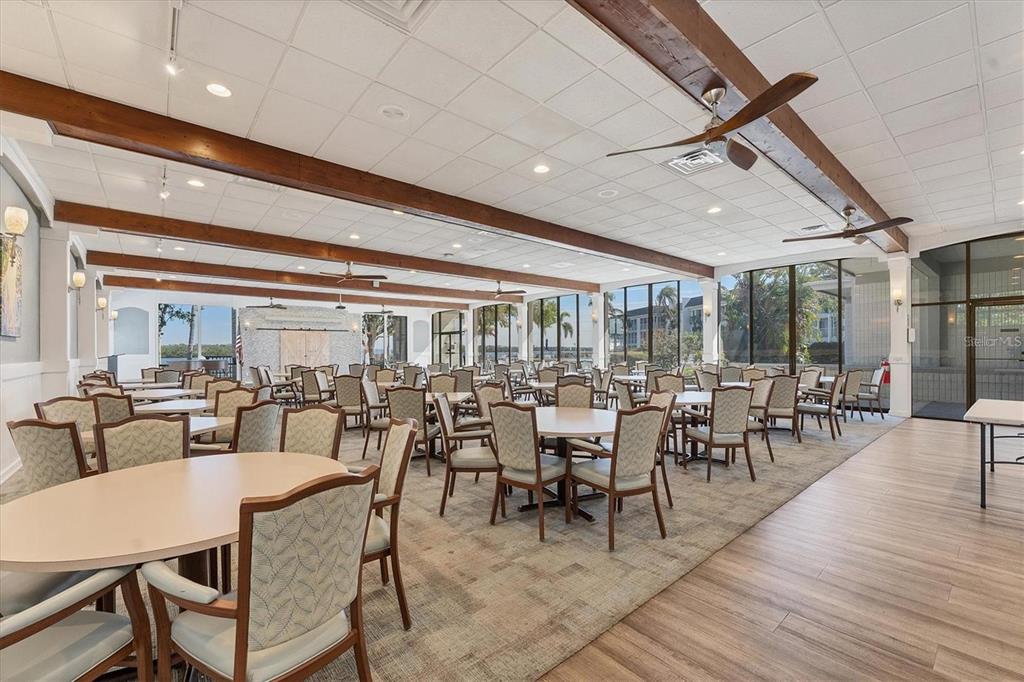 4390 Exeter Drive, Unit 305 Longboat Key, FL 34228 - Photo 78 of 78 a dining room with lots of tables and chairs
