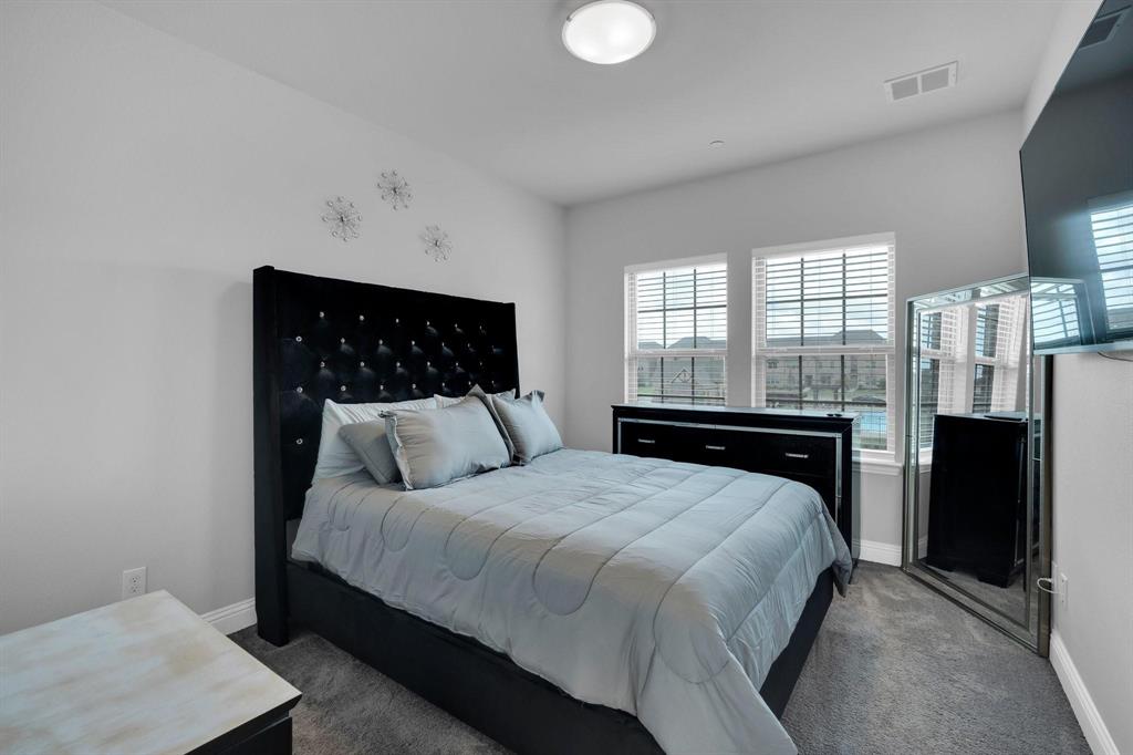 1498 Weston Road Dallas, TX 75234 - Photo 18 of 24 Carpeted room featuring a white ceiling and walls