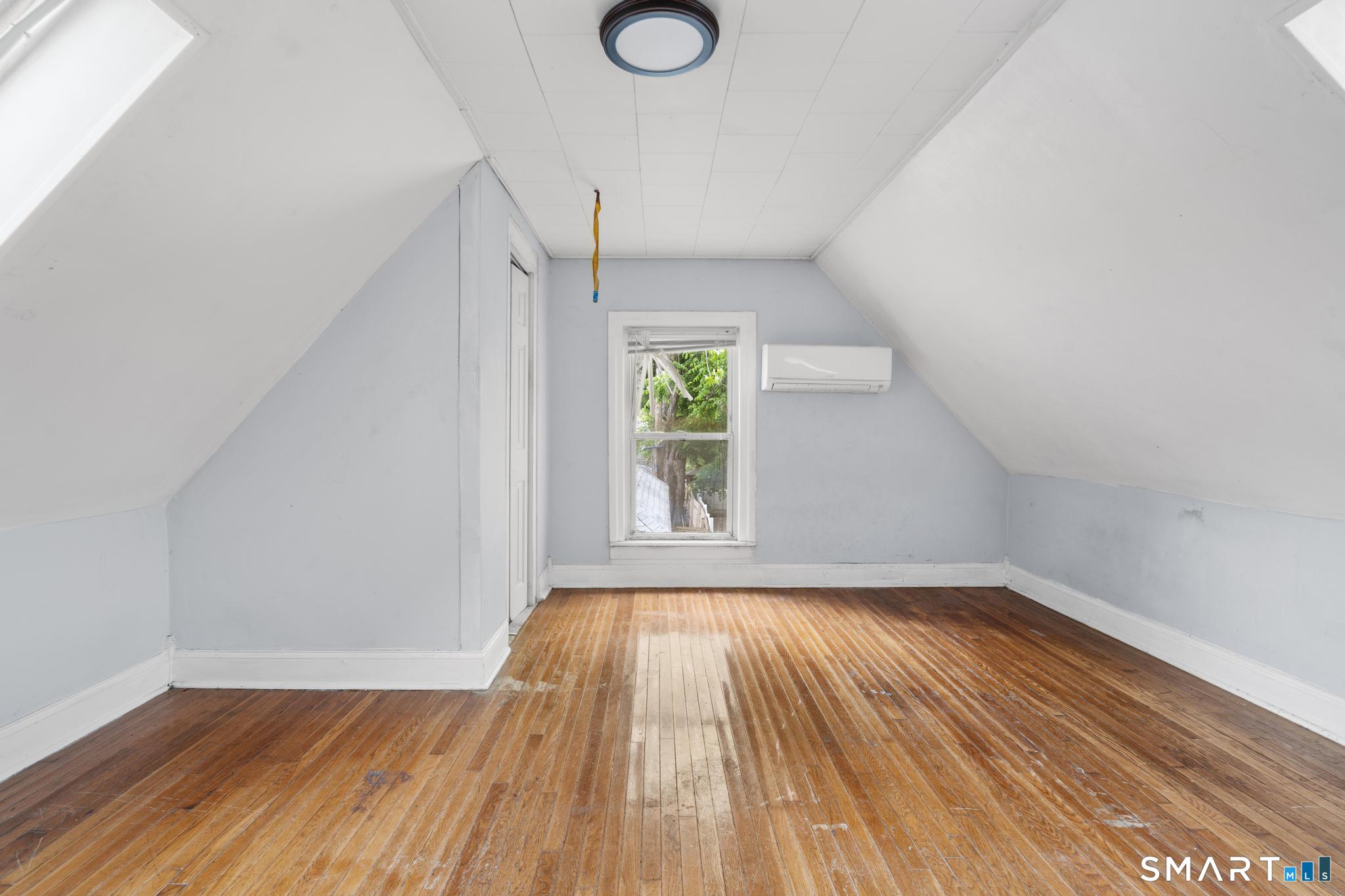 101 Meridian Street Meriden, CT 06451 - Photo 18 of 26 a view of room with window and wooden floor