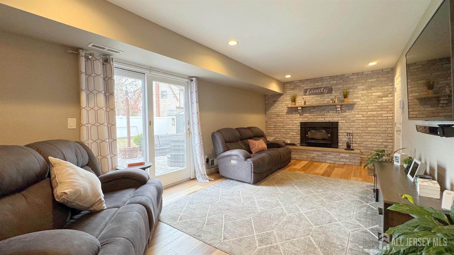 19 Norton Street Edison, NJ 08820 - Photo 13 of 29 a living room with furniture fireplace and a large window