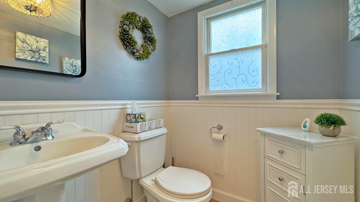 19 Norton Street Edison, NJ 08820 - Photo 16 of 29 a bathroom with a sink mirror and toilet
