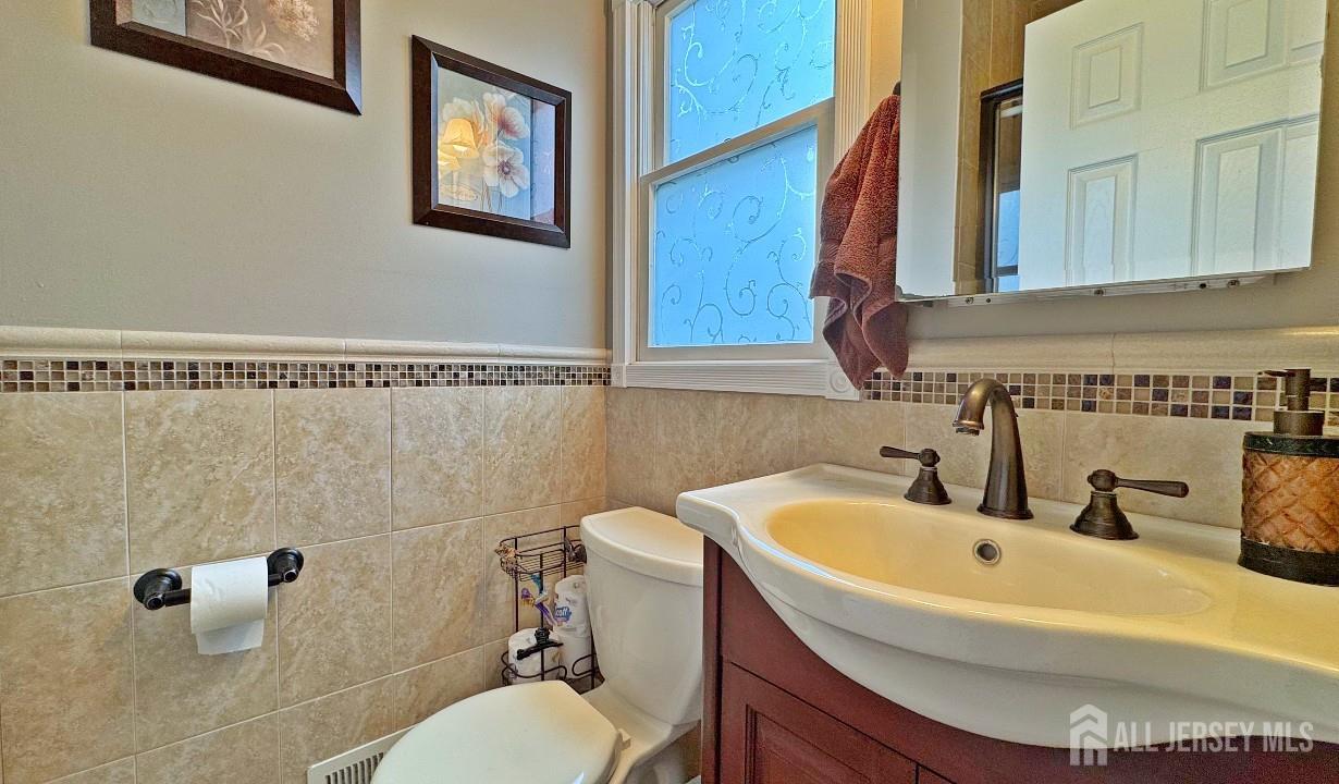 19 Norton Street Edison, NJ 08820 - Photo 18 of 29 a bathroom with a sink a toilet and shower