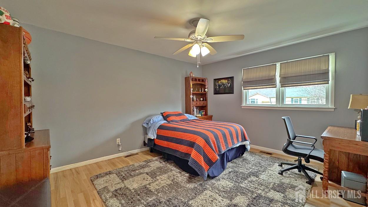 19 Norton Street Edison, NJ 08820 - Photo 21 of 29 a bedroom with a bed and a window