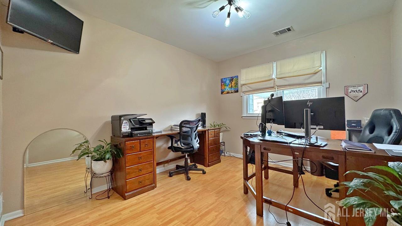 19 Norton Street Edison, NJ 08820 - Photo 23 of 29 a view of a workspace with furniture and a window