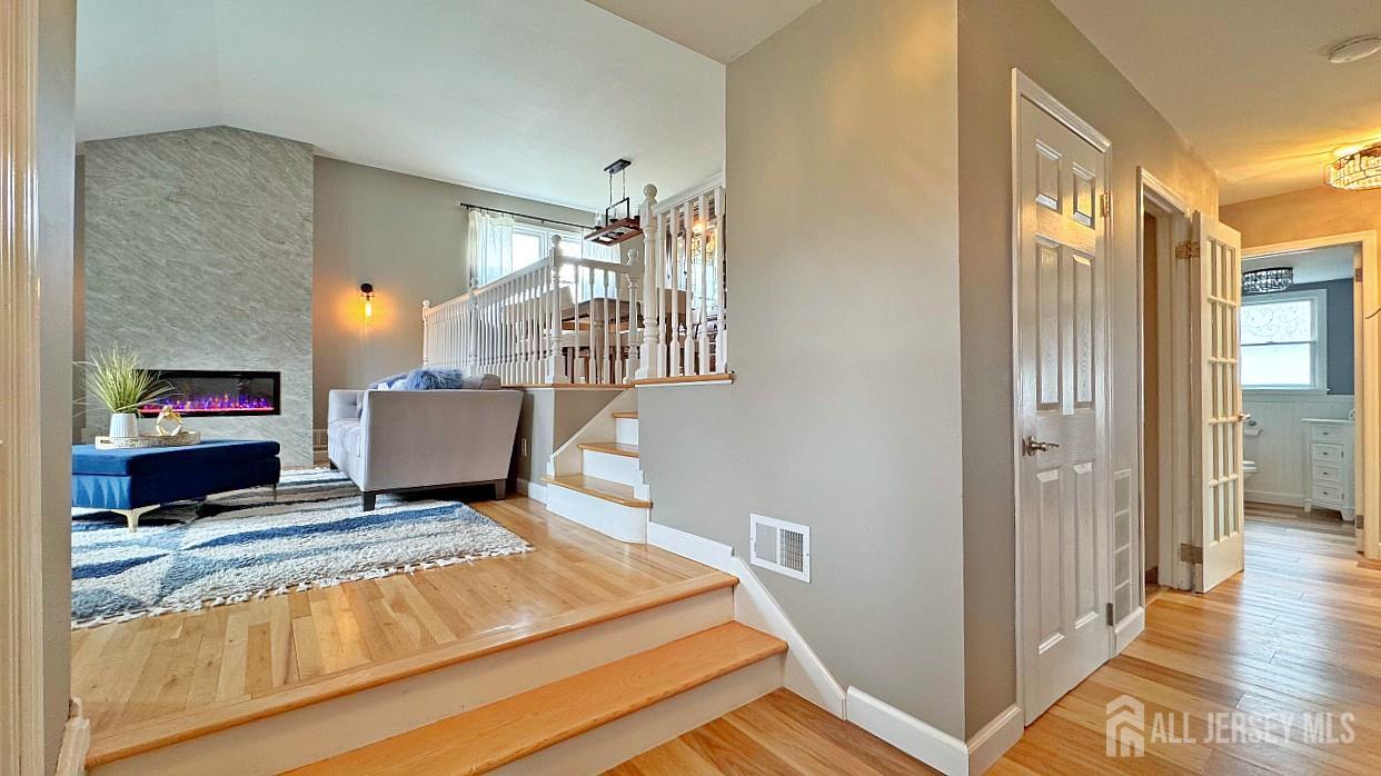 19 Norton Street Edison, NJ 08820 - Photo 4 of 29 a living room with furniture and a fireplace