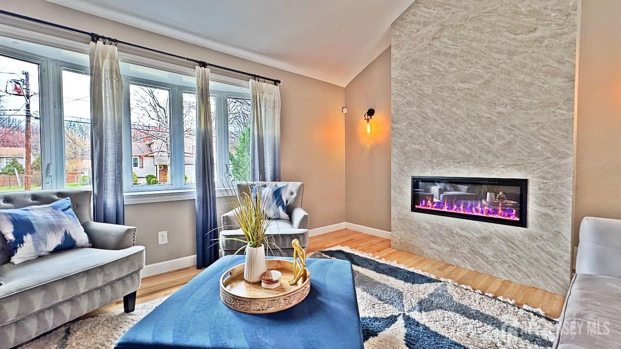 19 Norton Street Edison, NJ 08820 - Photo 6 of 29 a living room with furniture and a floor to ceiling window