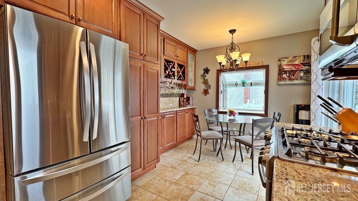 19 Norton Street Edison, NJ 08820 - Photo 10 of 29 a kitchen with stainless steel appliances granite countertop a refrigerator and a stove top oven