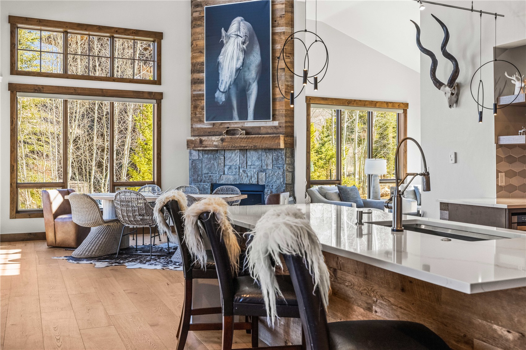 230 Game Trail Road Silverthorne, CO 80498 - Photo 2 of 43 a dining room with furniture and a large window