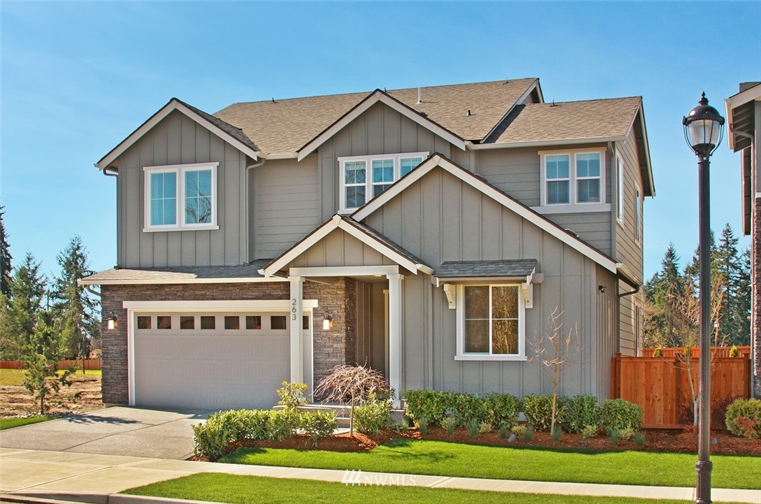 259 Field Place Southeast Renton, WA 98059 - Photo 1 of 1 a front view of a house with a yard and garage
