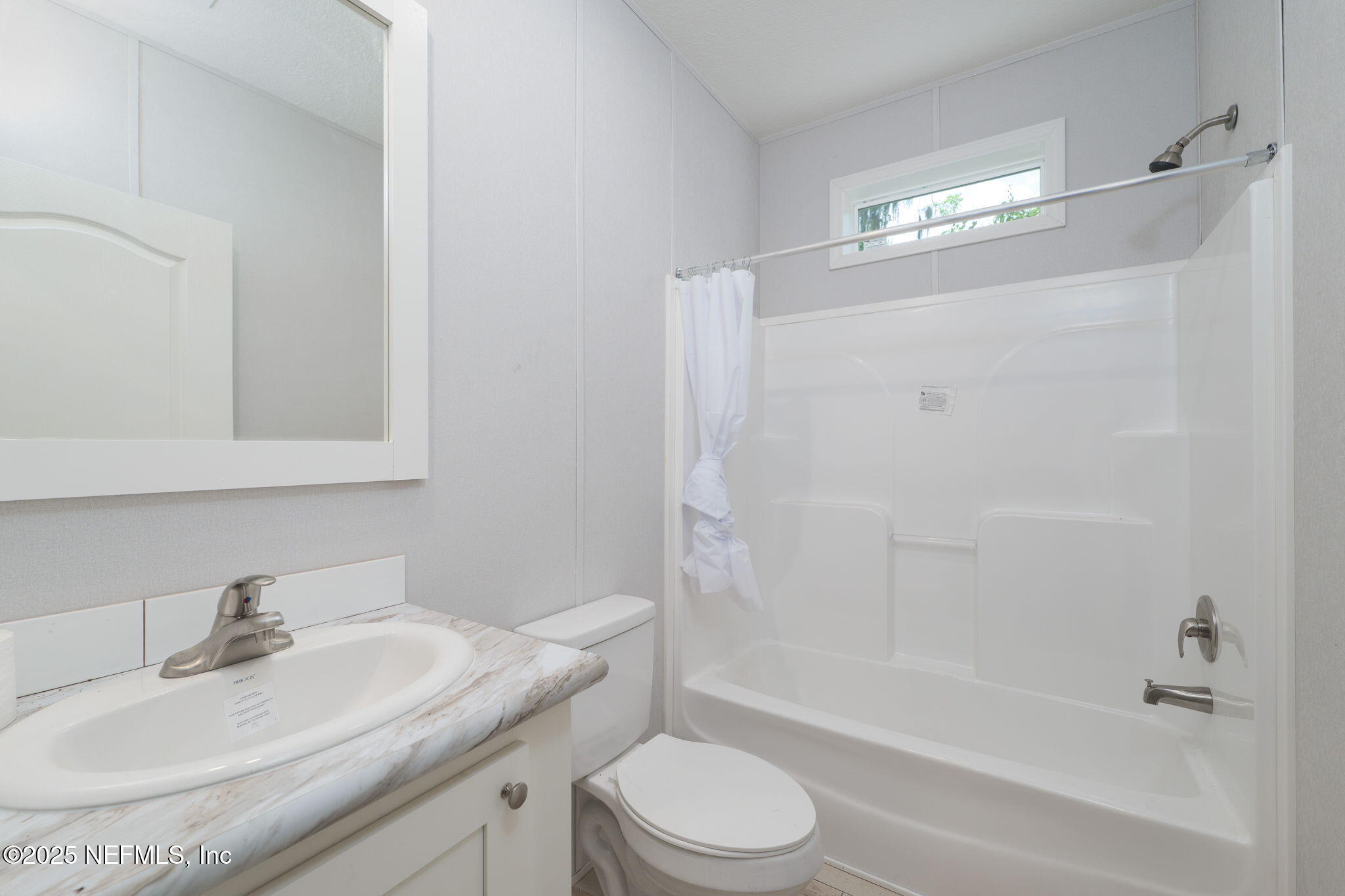 407 Sycamore Drive Macclenny, FL 32063 - Photo 15 of 25 a bathroom with a granite countertop sink a toilet and shower