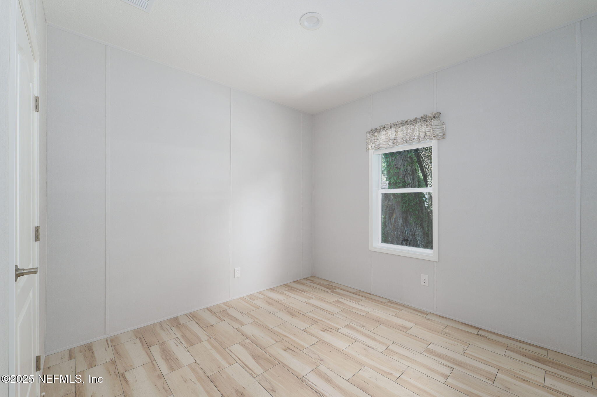 407 Sycamore Drive Macclenny, FL 32063 - Photo 16 of 25 an empty room with a window