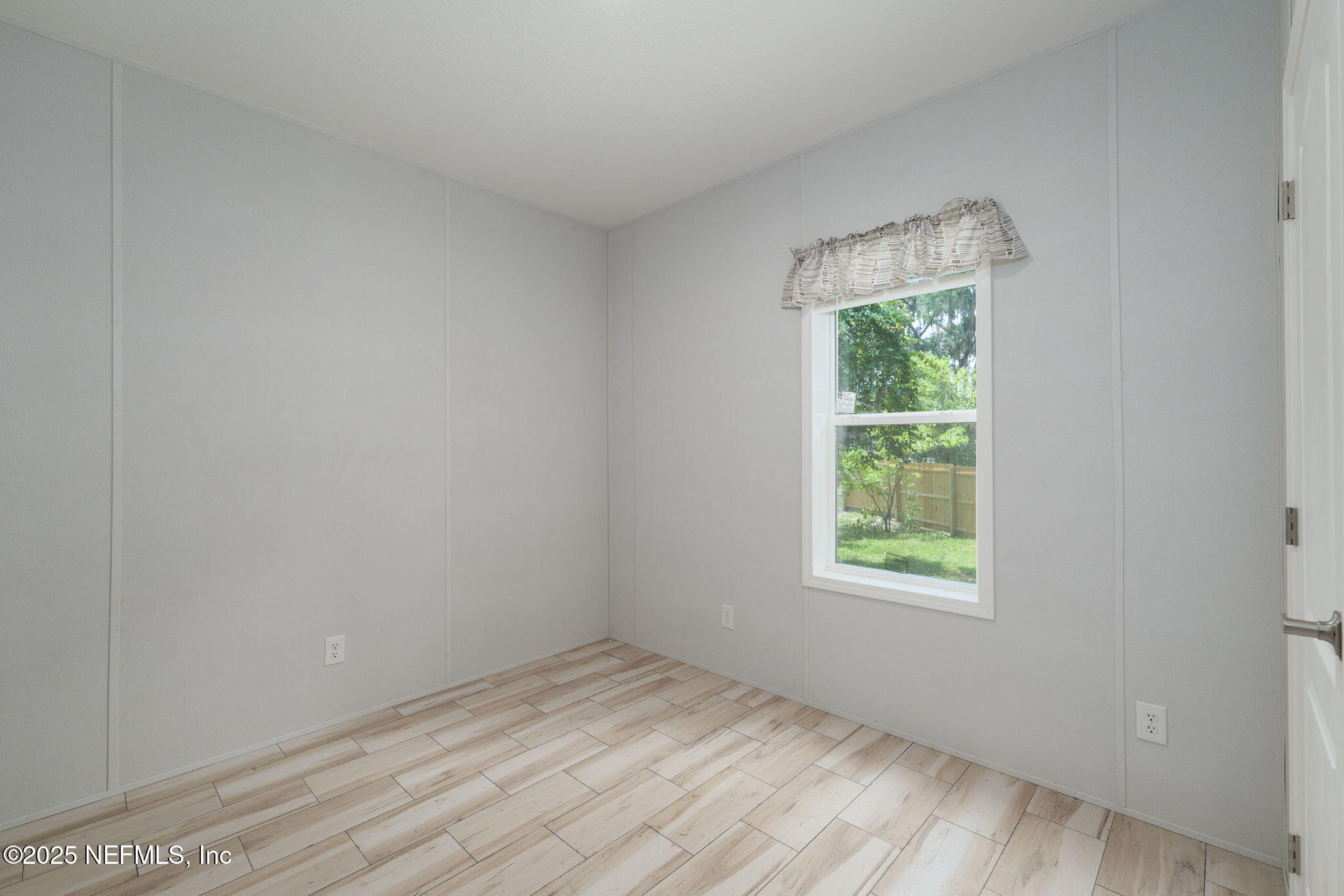 407 Sycamore Drive Macclenny, FL 32063 - Photo 18 of 25 an empty room with a window