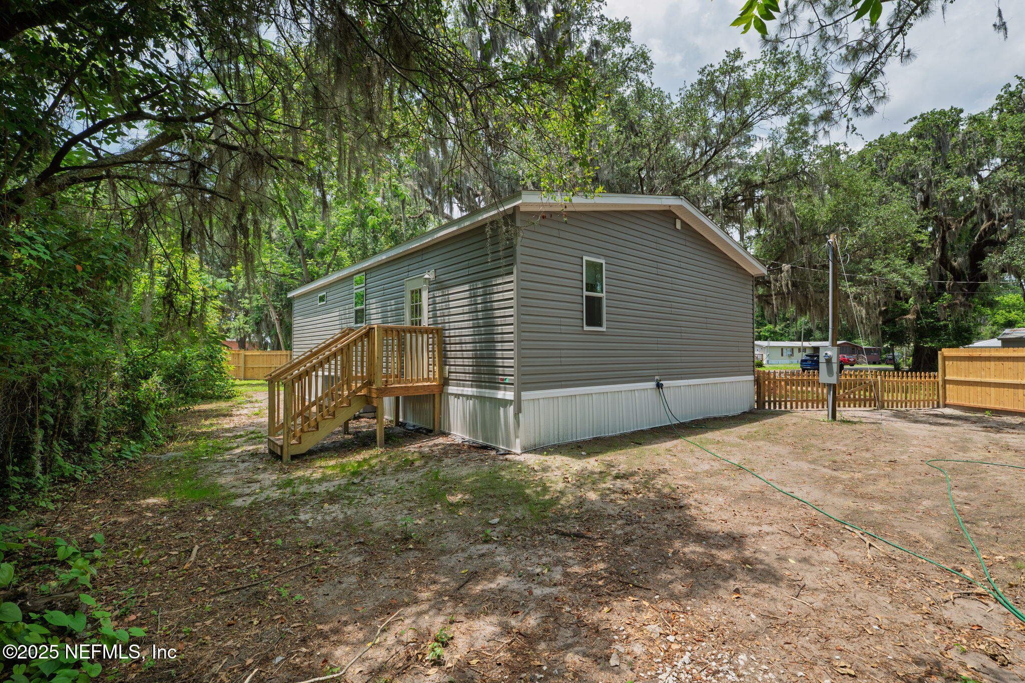 407 Sycamore Drive Macclenny, FL 32063 - Photo 24 of 25 a view of a house with a yard