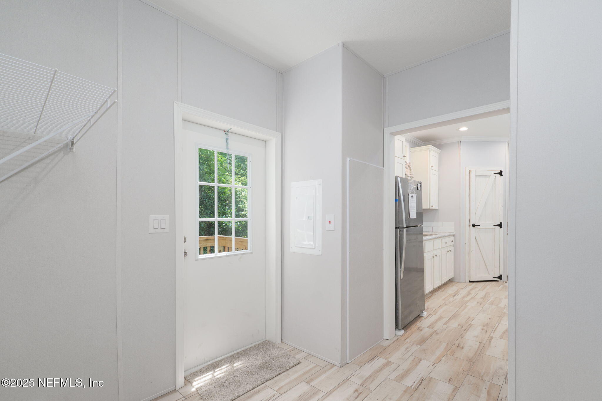 407 Sycamore Drive Macclenny, FL 32063 - Photo 7 of 25 a view of hallway with wooden floor