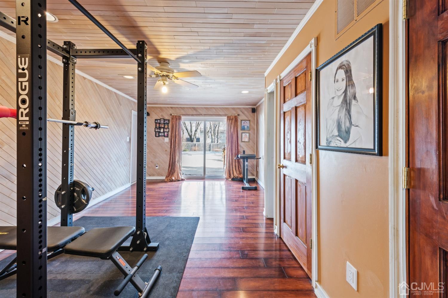 1 Jefferson Road East Brunswick, NJ 08816 - Photo 22 of 29 a view of a hallway with wooden floor and front door