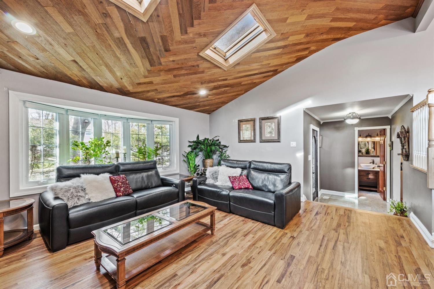 1 Jefferson Road East Brunswick, NJ 08816 - Photo 7 of 29 a living room with furniture and a large window