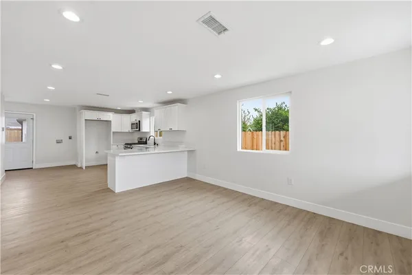 a view of kitchen with wooden floor