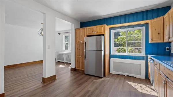 a kitchen with a refrigerator and a sink