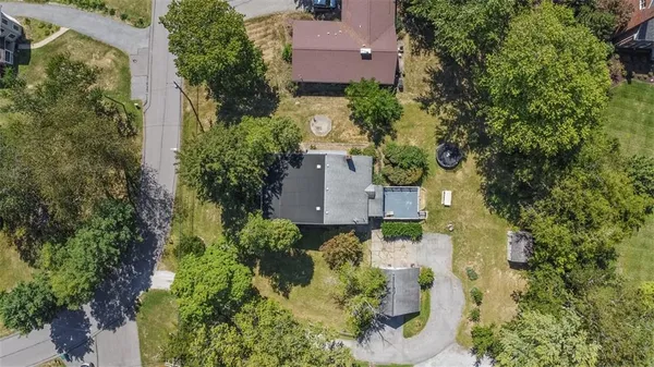 an aerial view of a house with a garden